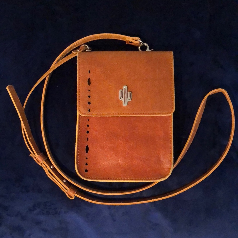 Brown leather crossbody with cactus emblem